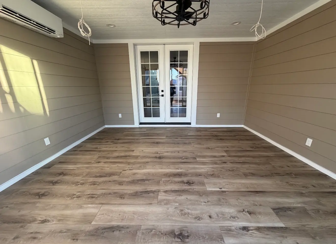 Finished lower-level enclosed sunroom interior