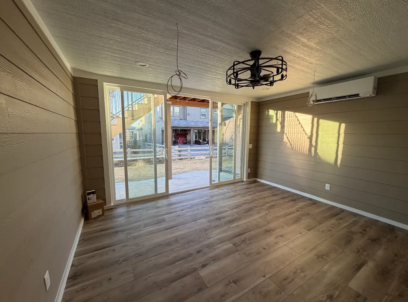 Finished enclosed sunroom interior with doors in Broomfield Colorado