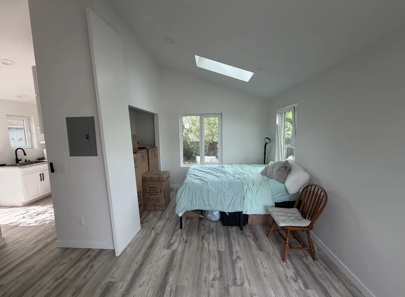 Bedroom area with skylight and windows inside the in-law suite