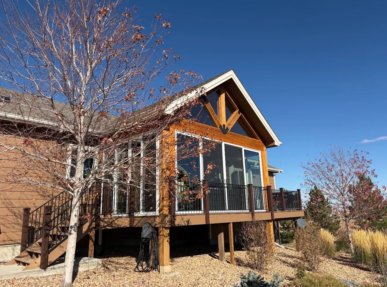 Angled exterior view of enclosed elevated sunroom in Elizabeth, Colorado