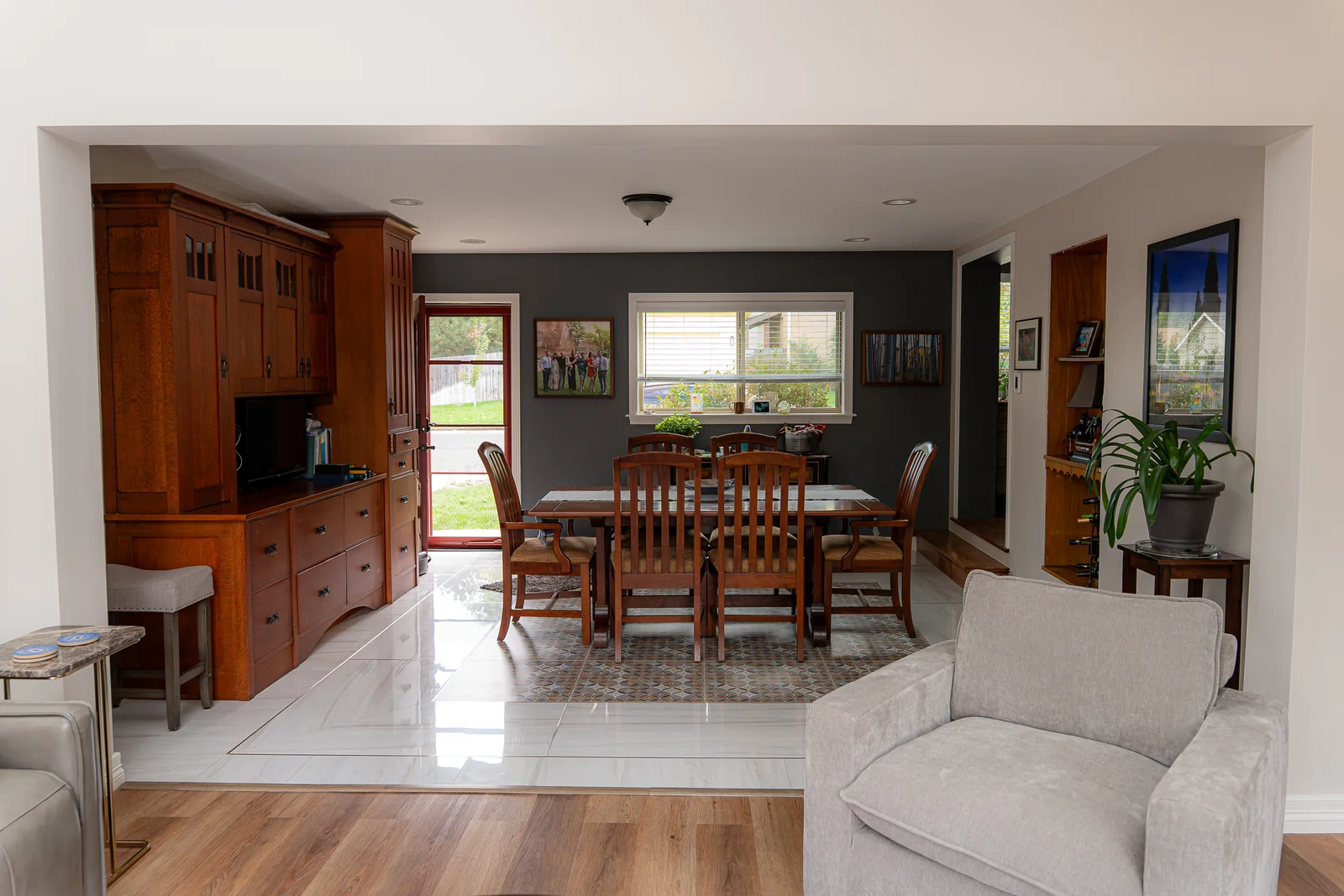 Connection between the sunroom seating area and the existing dining space