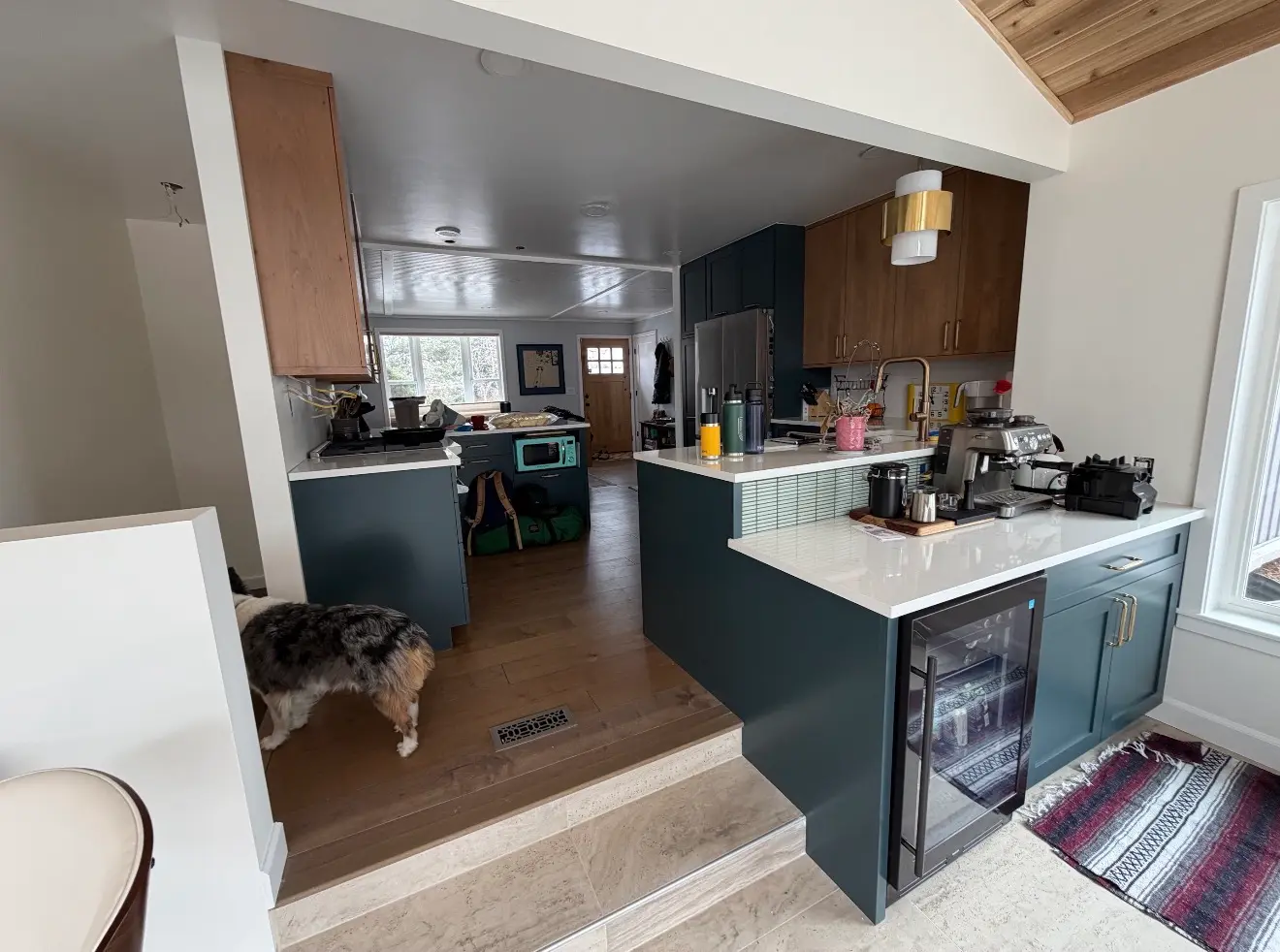 Updated kitchen with island connected to new sunroom in Boulder, Colorado