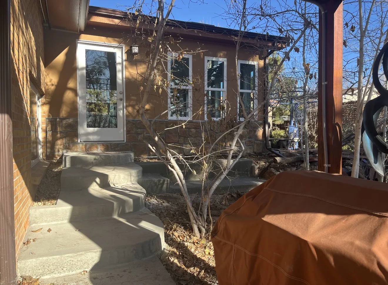 Entry side view of Lakewood gable roof sunroom addition with custom windows