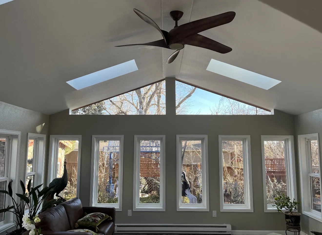 Vaulted interior ceiling with skylights and custom windows in Lakewood sunroom