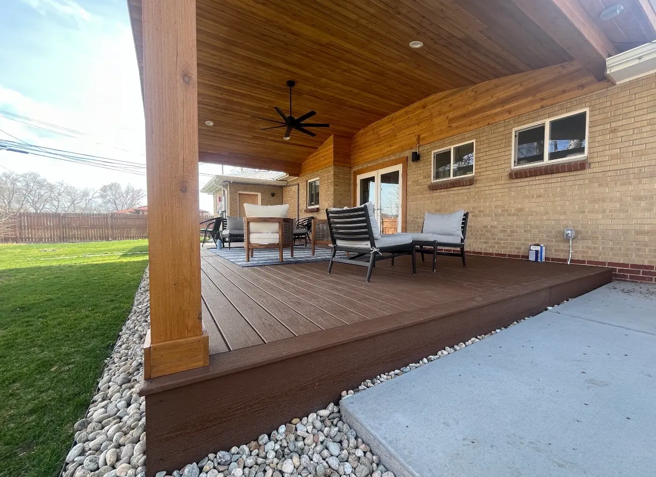 Composite deck and covered patio with seating in Wheat Ridge, Colorado