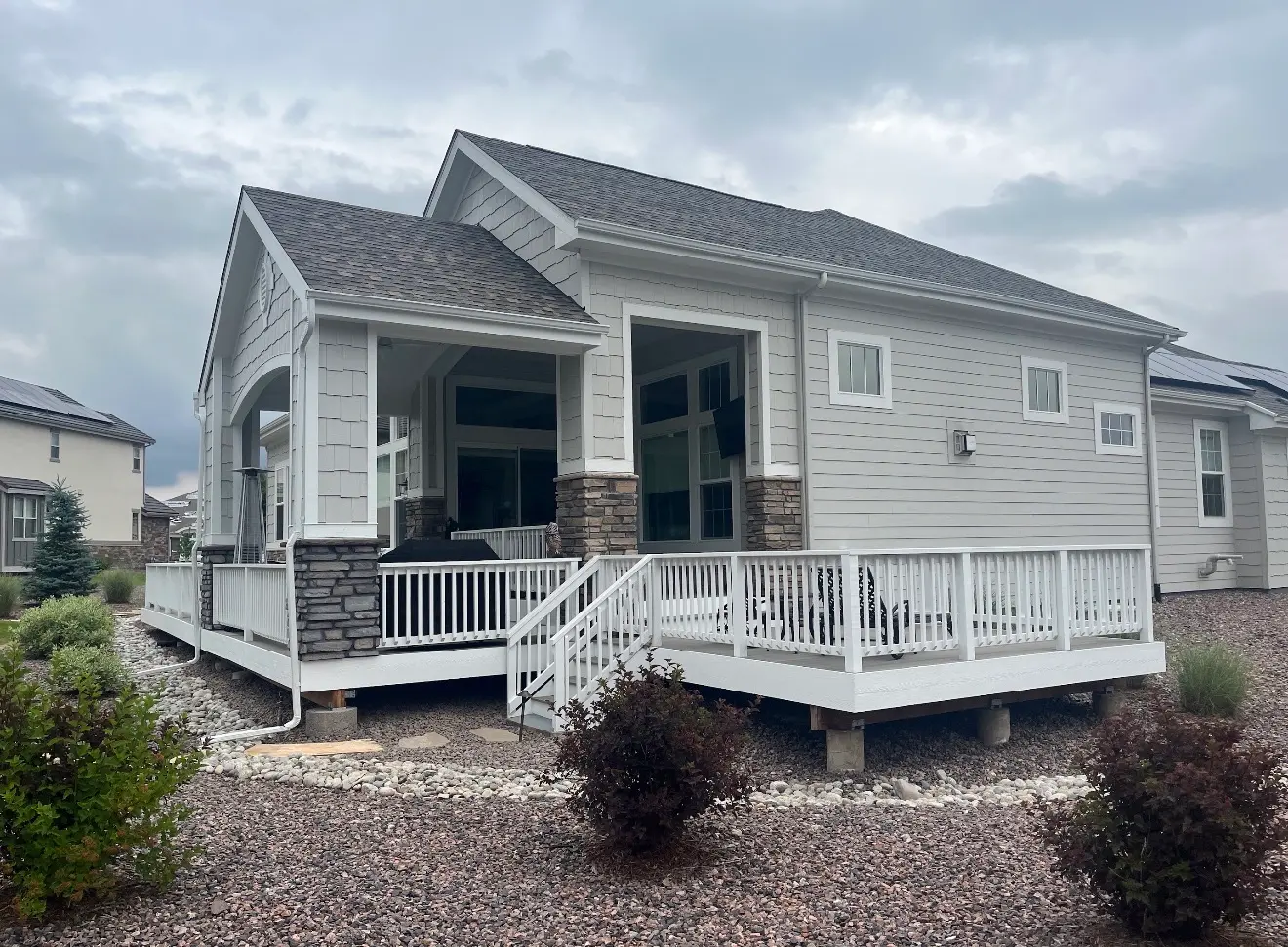 Angled exterior view of covered deck matching house architecture in Columbine Valley, Colorado