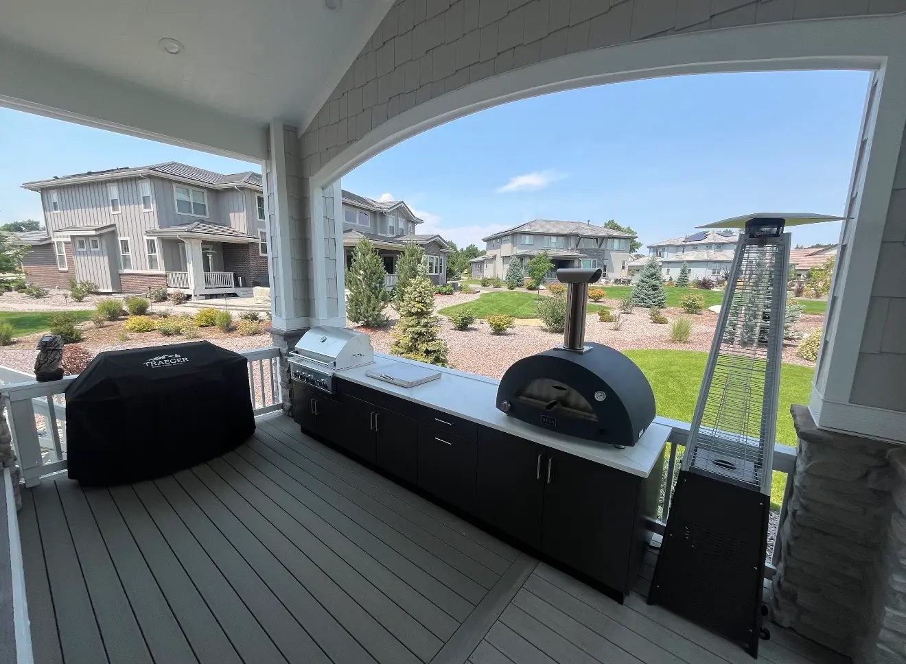 Outdoor kitchen appliances and covered deck space in Columbine Valley, Colorado