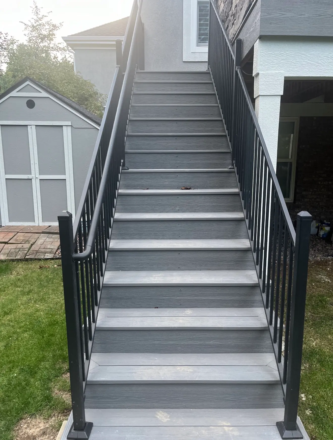 Composite staircase with steel railings for elevated deck in Aurora, Colorado