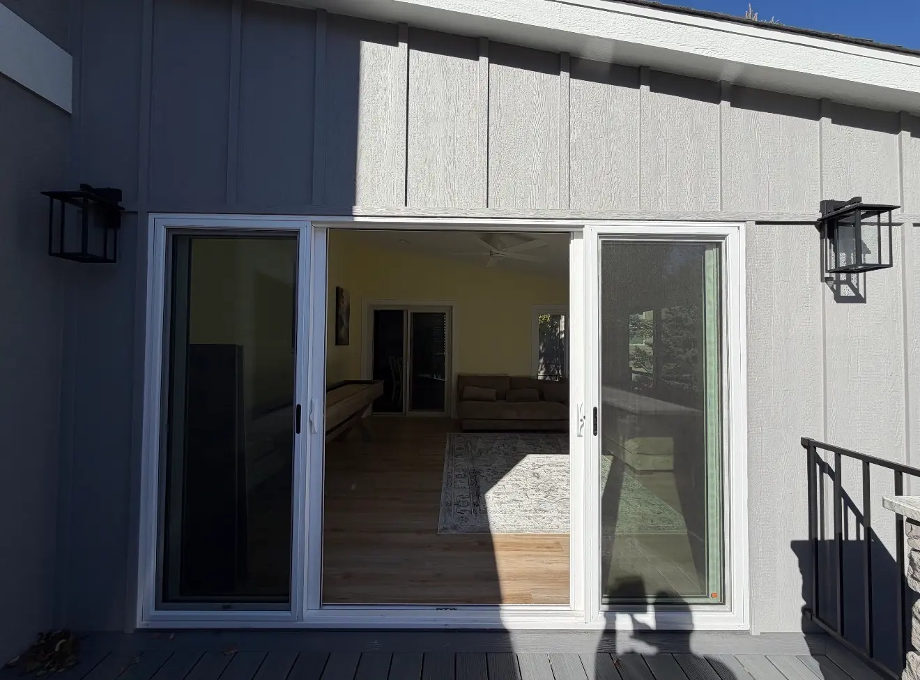 Sliding door access from elevated sunroom to grilling deck in Aurora, Colorado