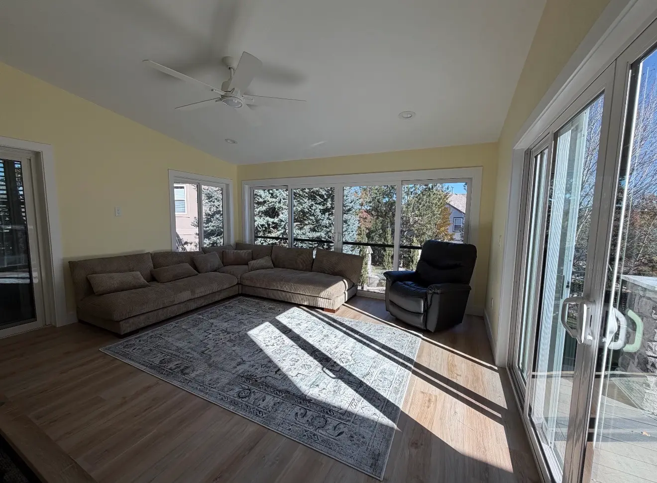 Interior of elevated second-story sunroom with large windows in Aurora, Colorado
