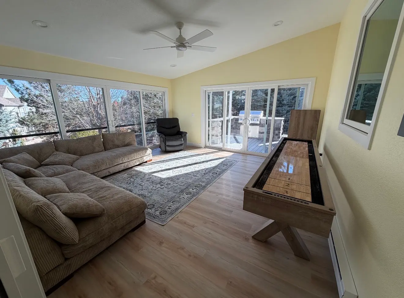 Interior view of second-story sunroom connected to deck in Aurora, Colorado
