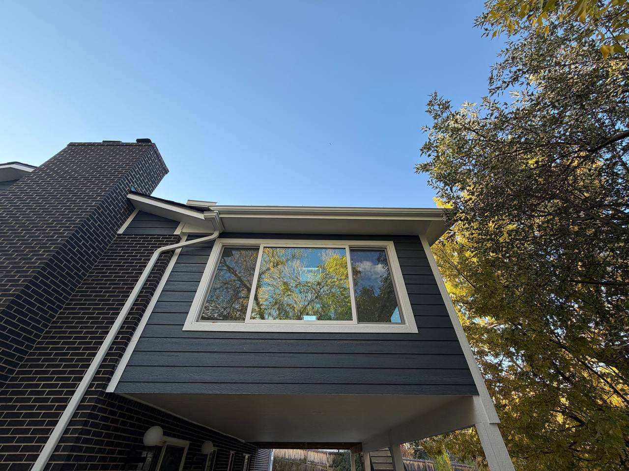 Elevated sunroom enclosure and deck in Centennial Colorado